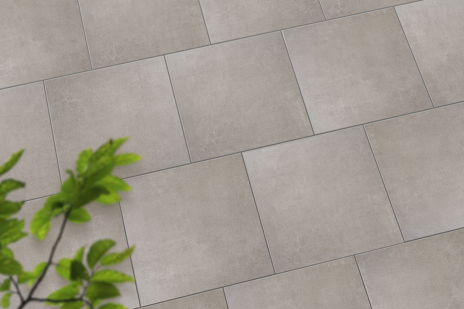 Verlegte CeramicLine³-Platten in grau von Woehe & Heydemann in 60x60 – Beton-Optik mit harmonischer Linienführung 