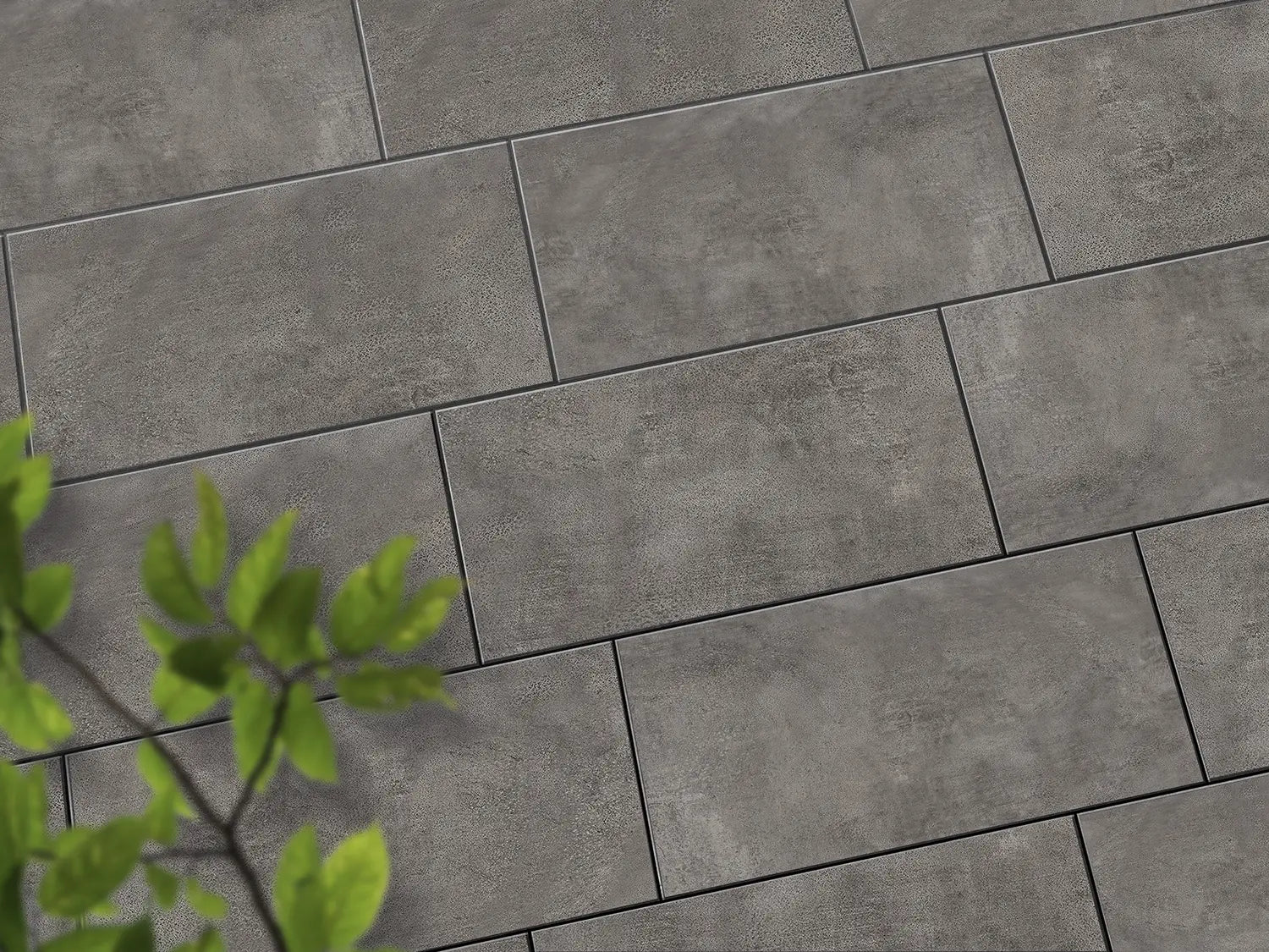Verlegte CeramicLine³-Platten in grau von Woehe & Heydemann in 80x40 – Beton-Optik mit harmonischer Linienführung 