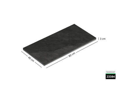 Saubere Schnittkante der 80x40 Terrassenplatte in anthraziter Natursteinoptik von Woehe & Heydemann mit feinkörniger Oberfläche  