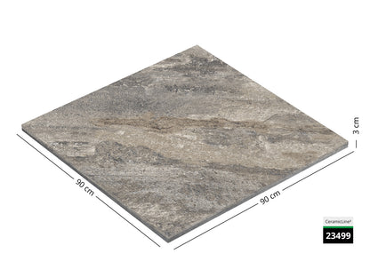 Saubere Schnittkante der 90x90 Terrassenplatte in beiger Natursteinoptik von Woehe & Heydemann mit feinkörniger Oberfläche  