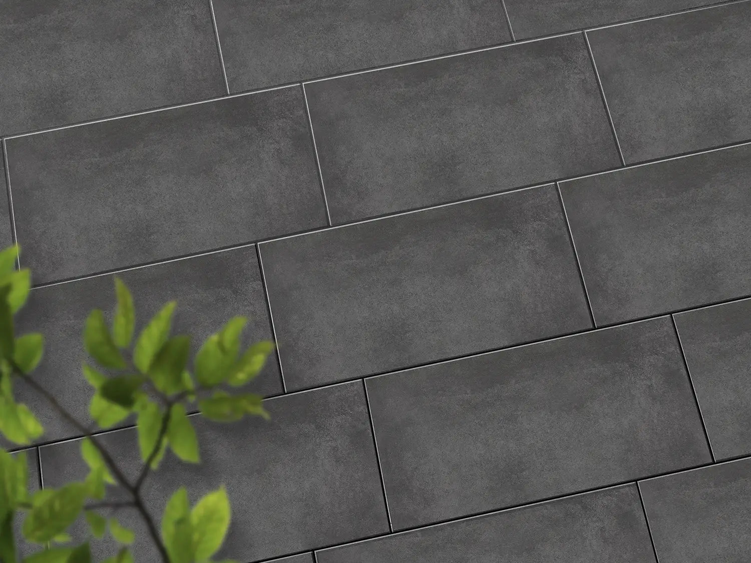 Verlegte CeramicLine³-Platten in anthrazit von Woehe & Heydemann in 80x40 - Beton-Optik mit harmonischer Linienführung 