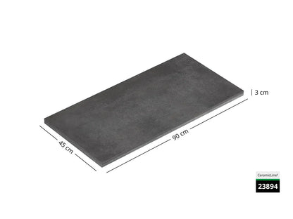 Saubere Schnittkante der 90x45 Terrassenplatte in grauer Betonoptik von Woehe & Heydemann mit Keramik Oberfläche zum Aktionspreis