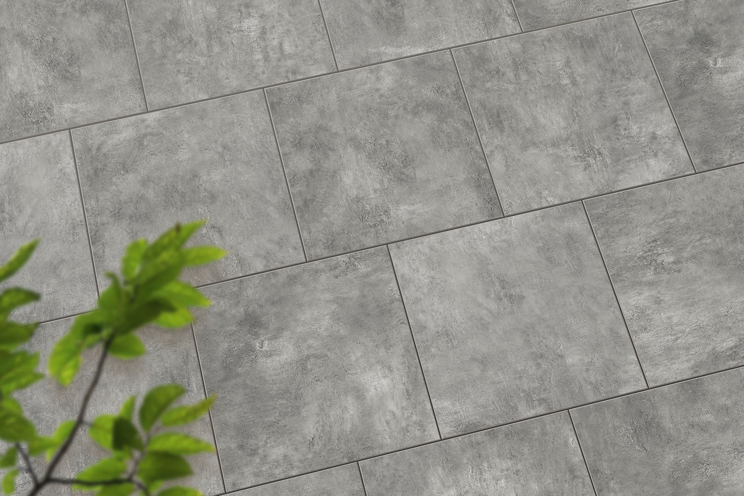 Verlegte CeramicLine³-Platten in grau von Woehe & Heydemann in 90x90 – Naturstein-Optik mit harmonischer Linienführung 