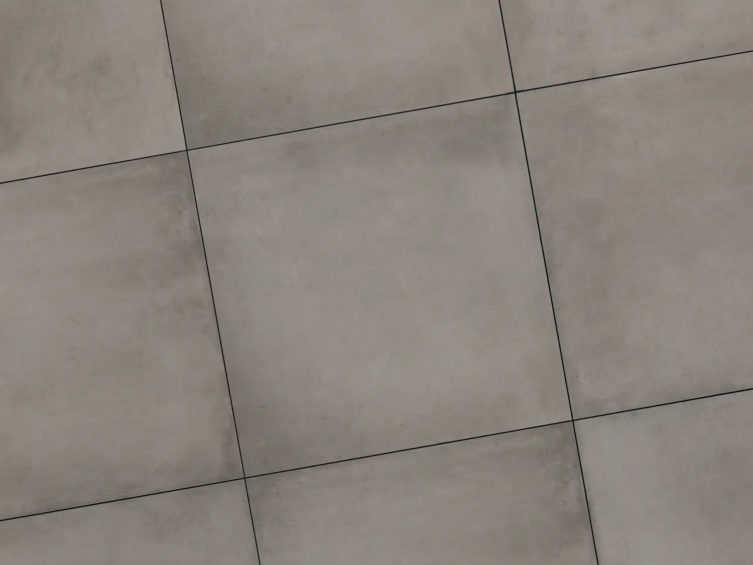 Verlegte CeramicLine²-Platten in grau von Woehe & Heydemann in 100x100 – Beton-Optik mit harmonischer Linienführung