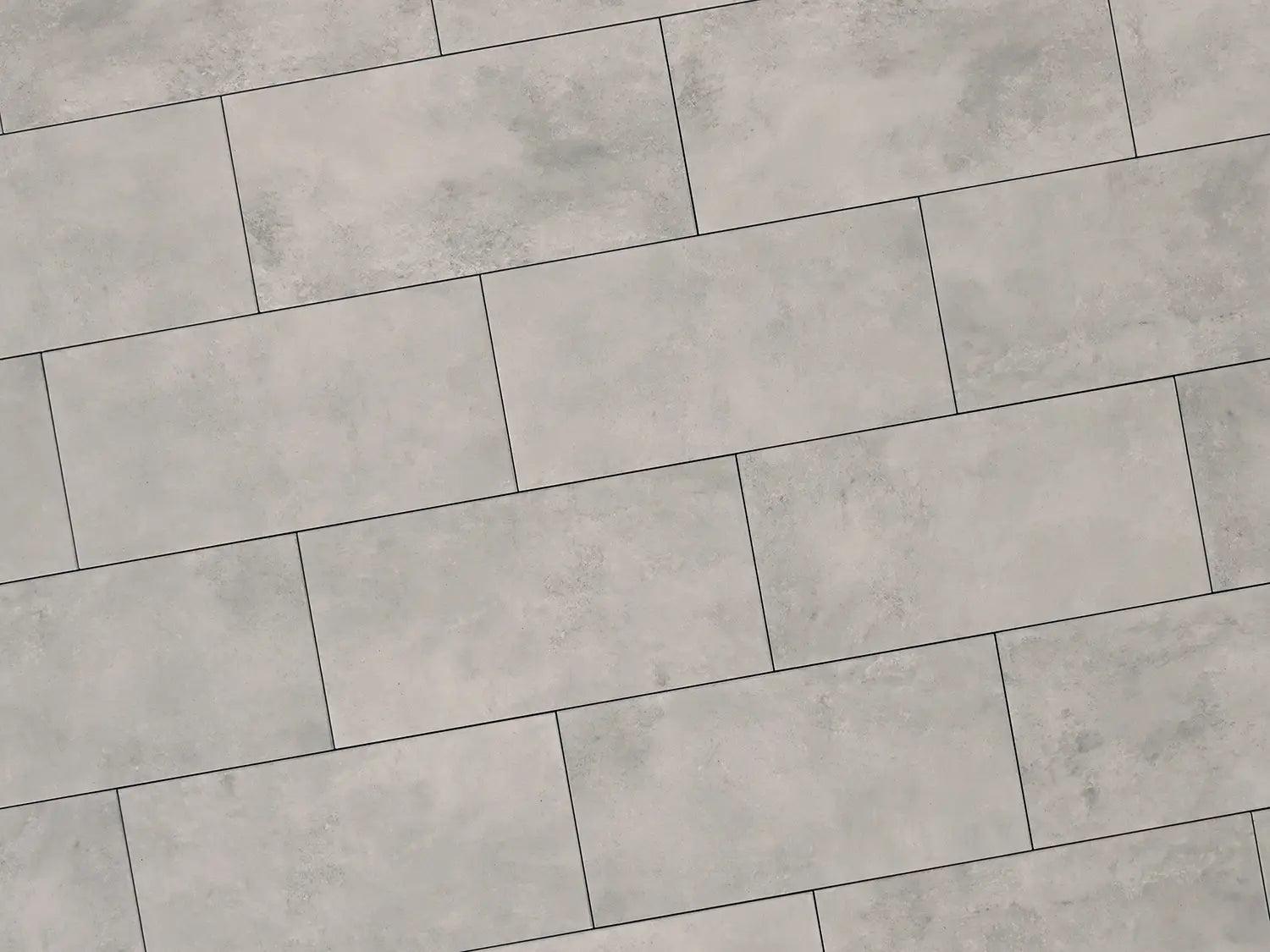 Verlegte NanoLine-Platten in grau von Woehe & Heydemann in 40x80. Beton-Optik mit harmonischer Linienführung.