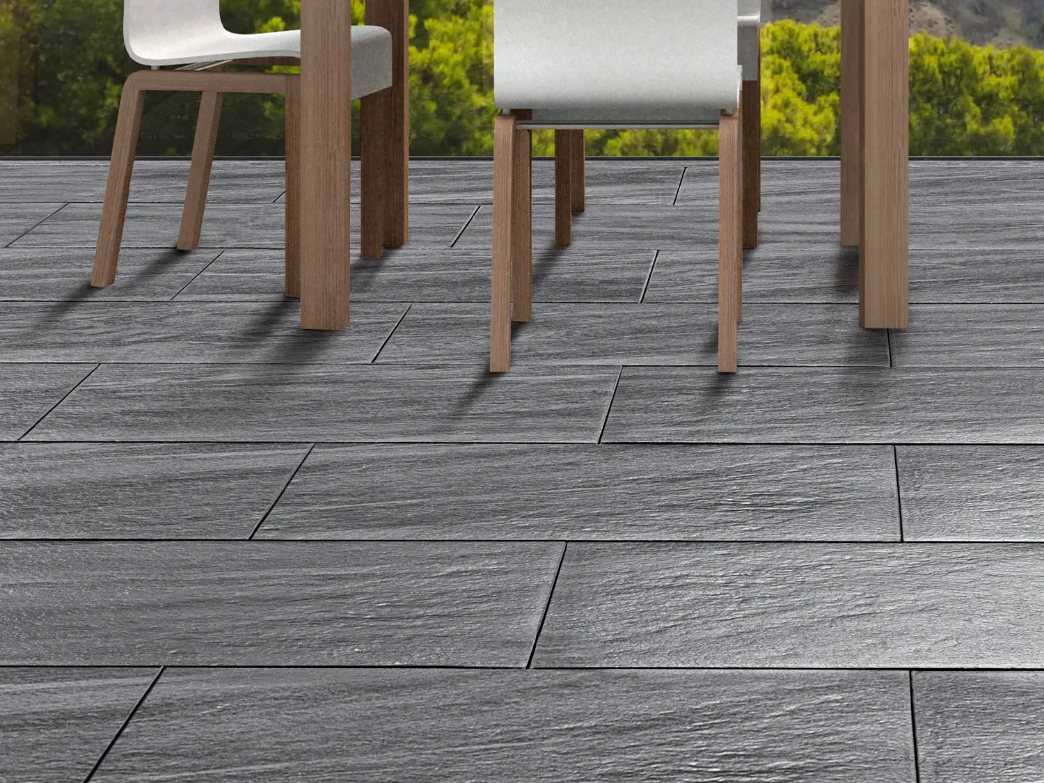100x50 CreativeLine-Terrassenplatten in grauer Naturstein-Optik von Woehe & Heydemann verlegt auf einer Terrasse 