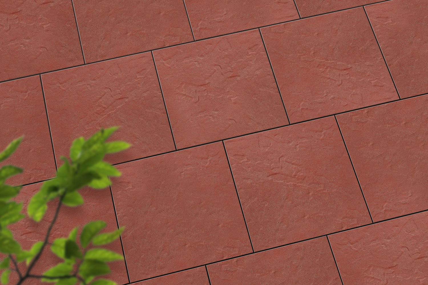 Verlegte LuxoGran-Platten in rot von Woehe & Heydemann in 50x50 – Naturstein-Optik mit harmonischer Linienführung 